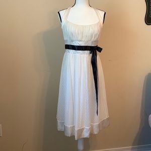 White backless cocktail dress.